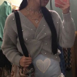 Plush grey wrap sweater with pearl detail